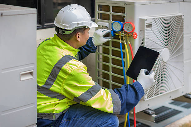 Professional Heat Pump Repair technician working in Flanders, NY